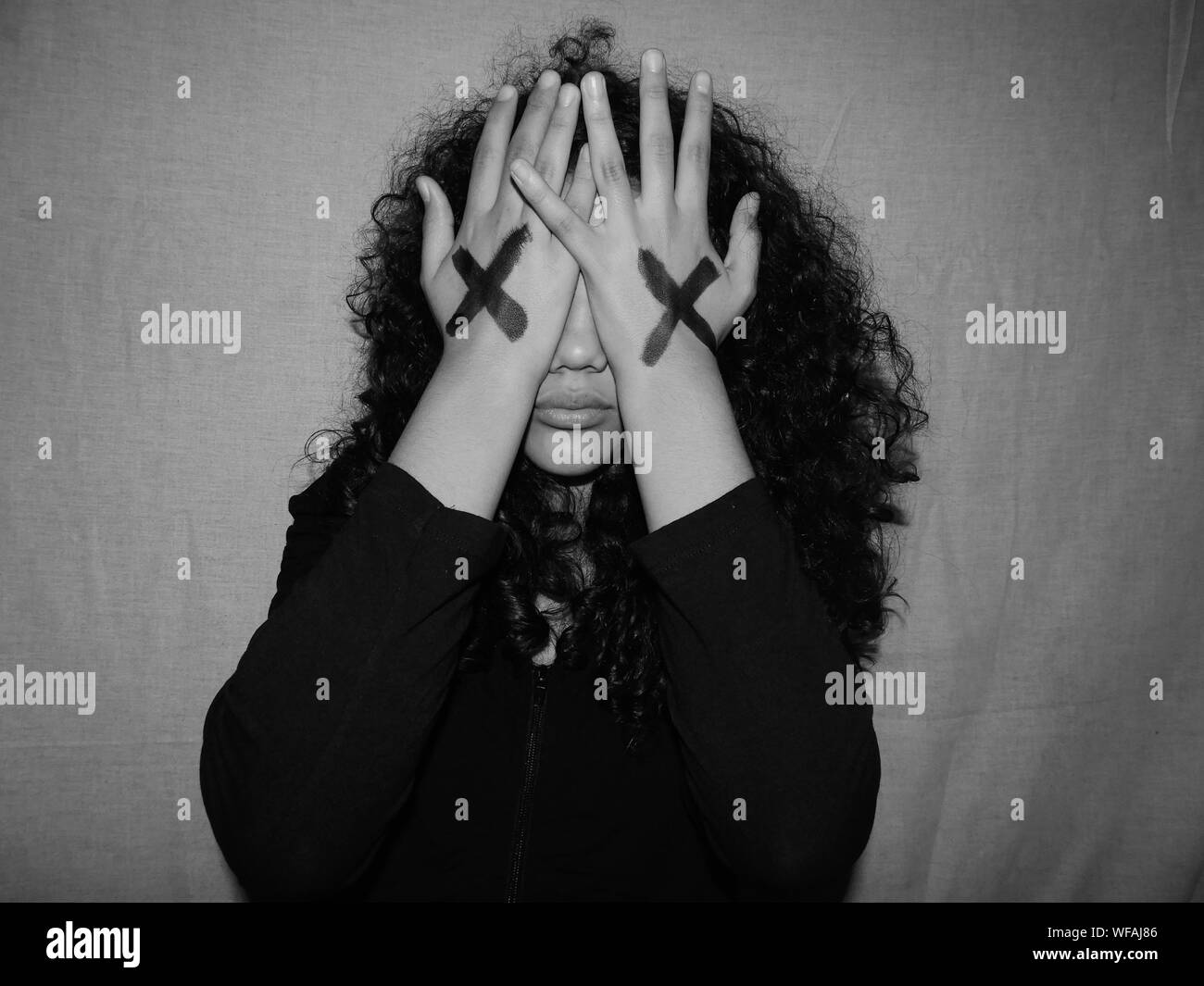 Woman hiding face black and white stock photos images