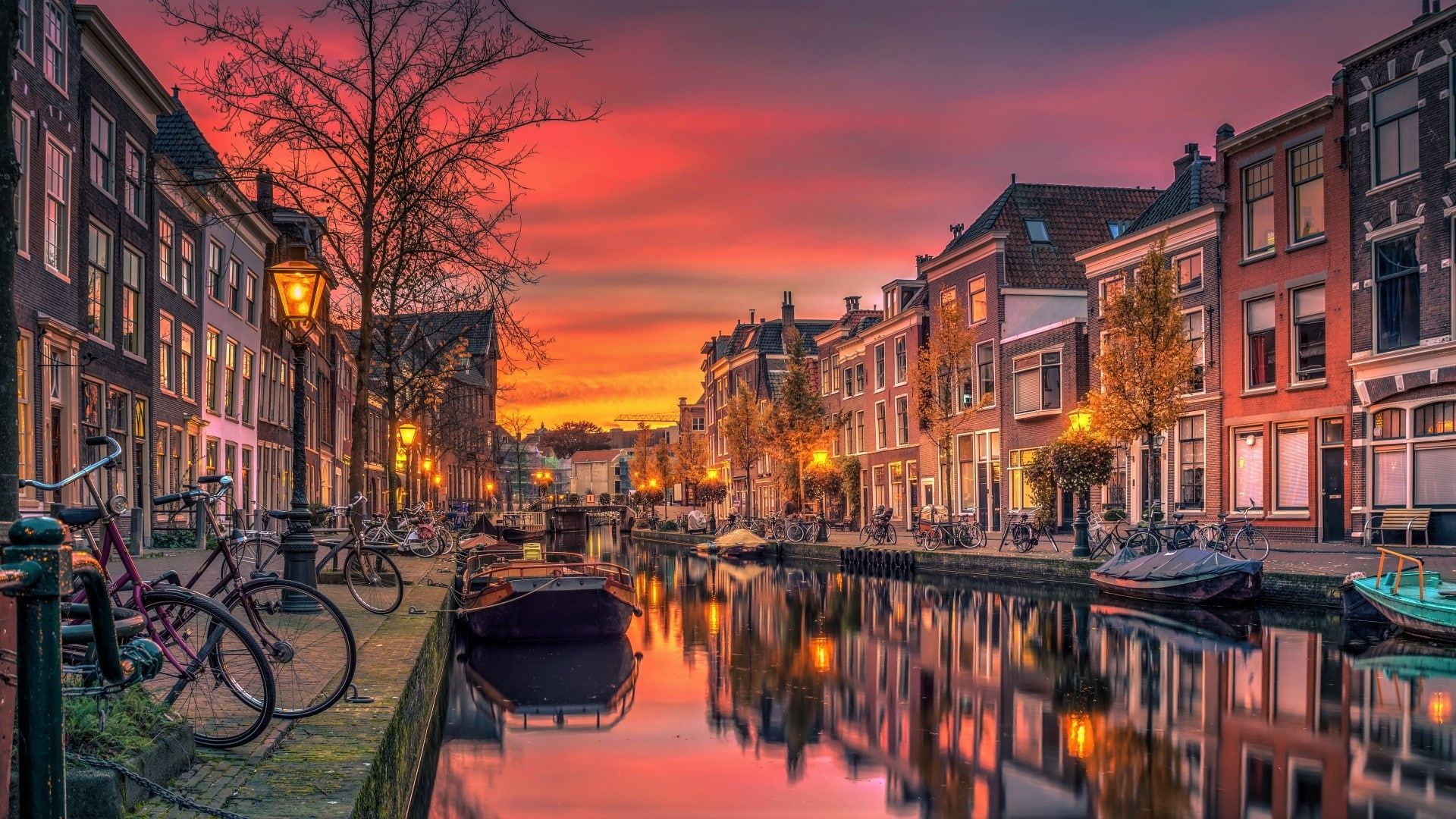 Amsterdam canal sunset houses bicycle boats germany city p wallpaper hdwallpaper desktop sunset art sunset canvas amsterdam wallpaper