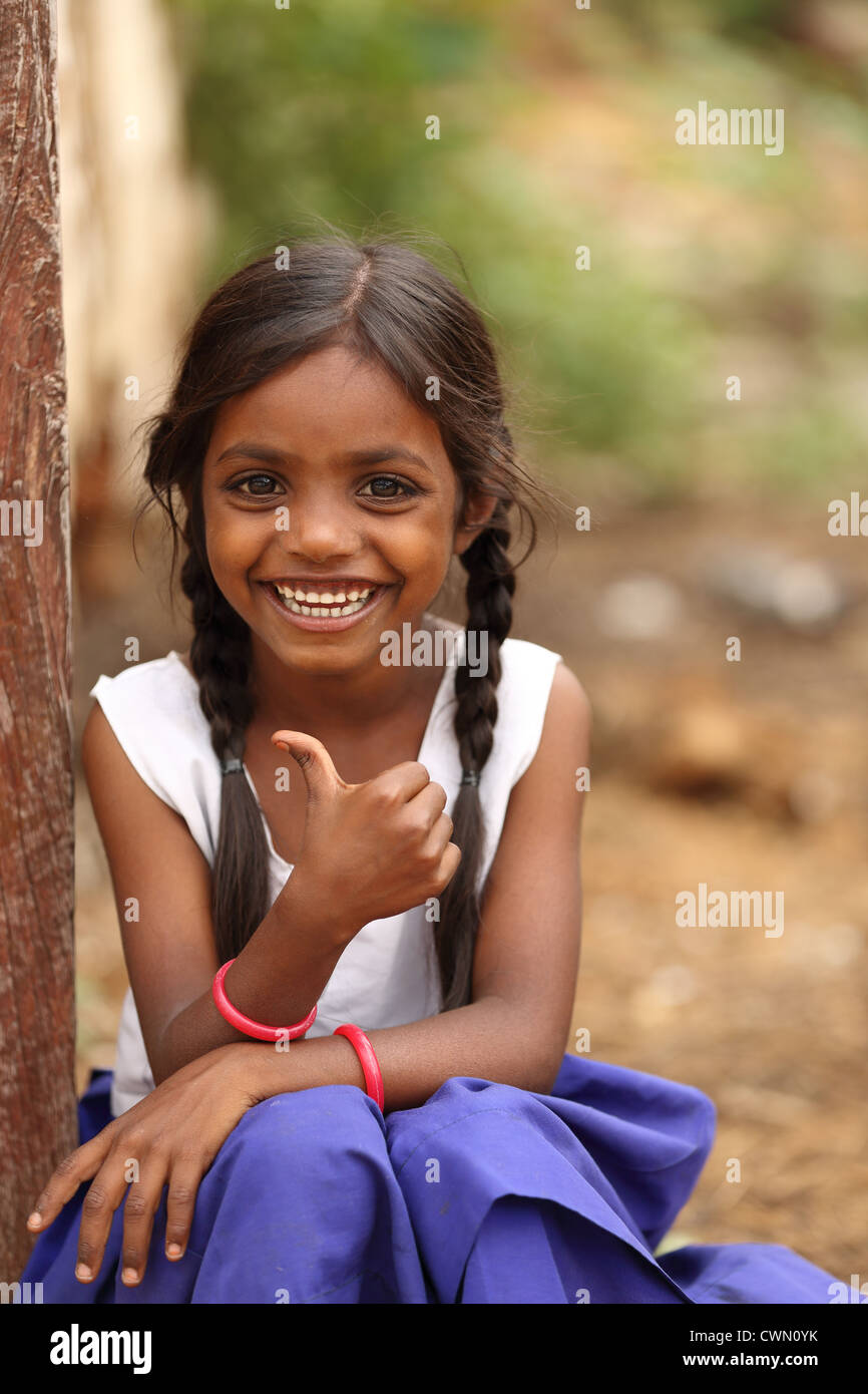 Young indian rural girl doing a thumbs up andhra pradesh south india stock photo