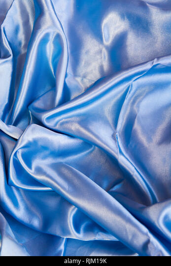 Blue Satin Background. A soft light blue satin material background