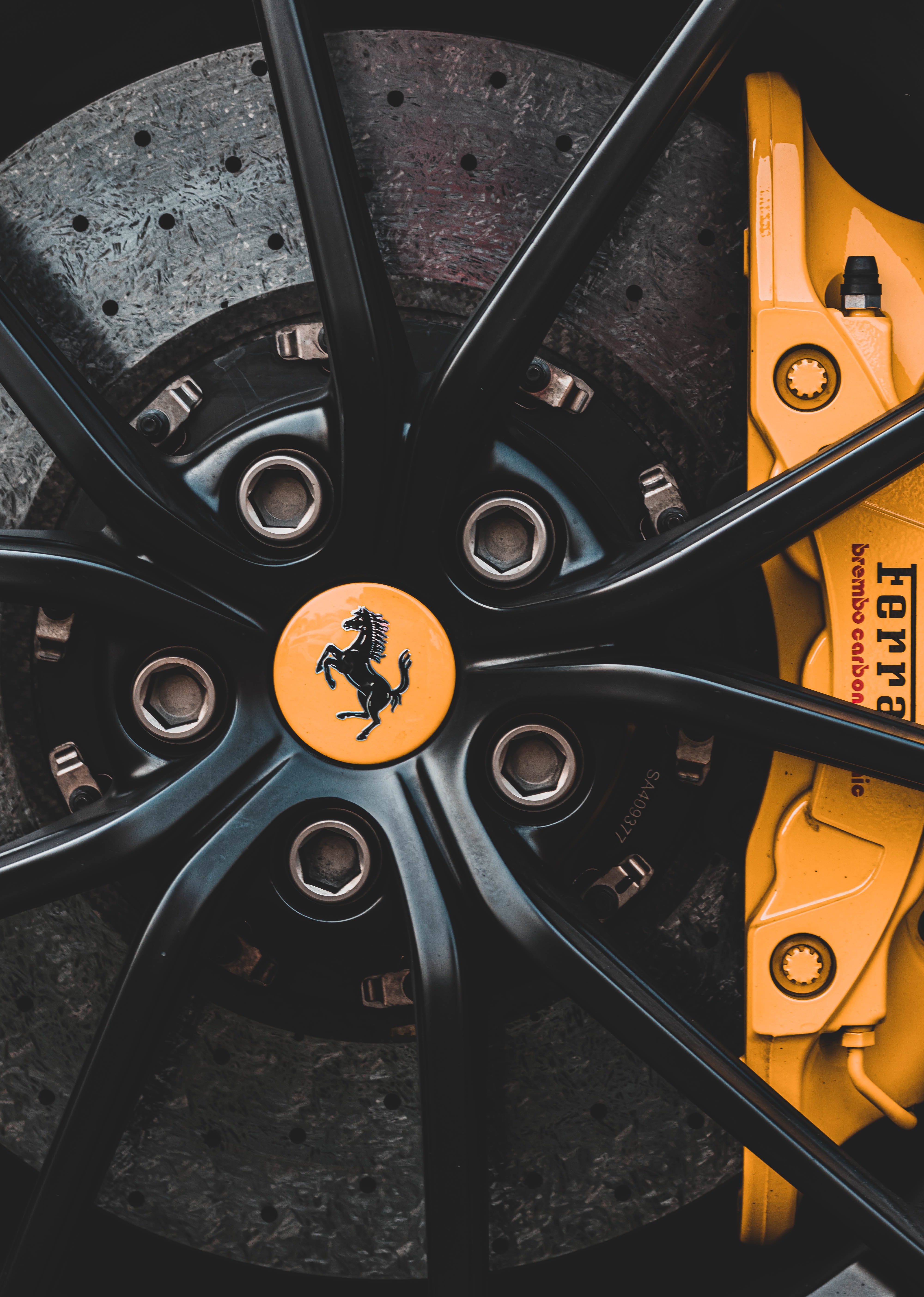 Black alloy rims with ferrari logo