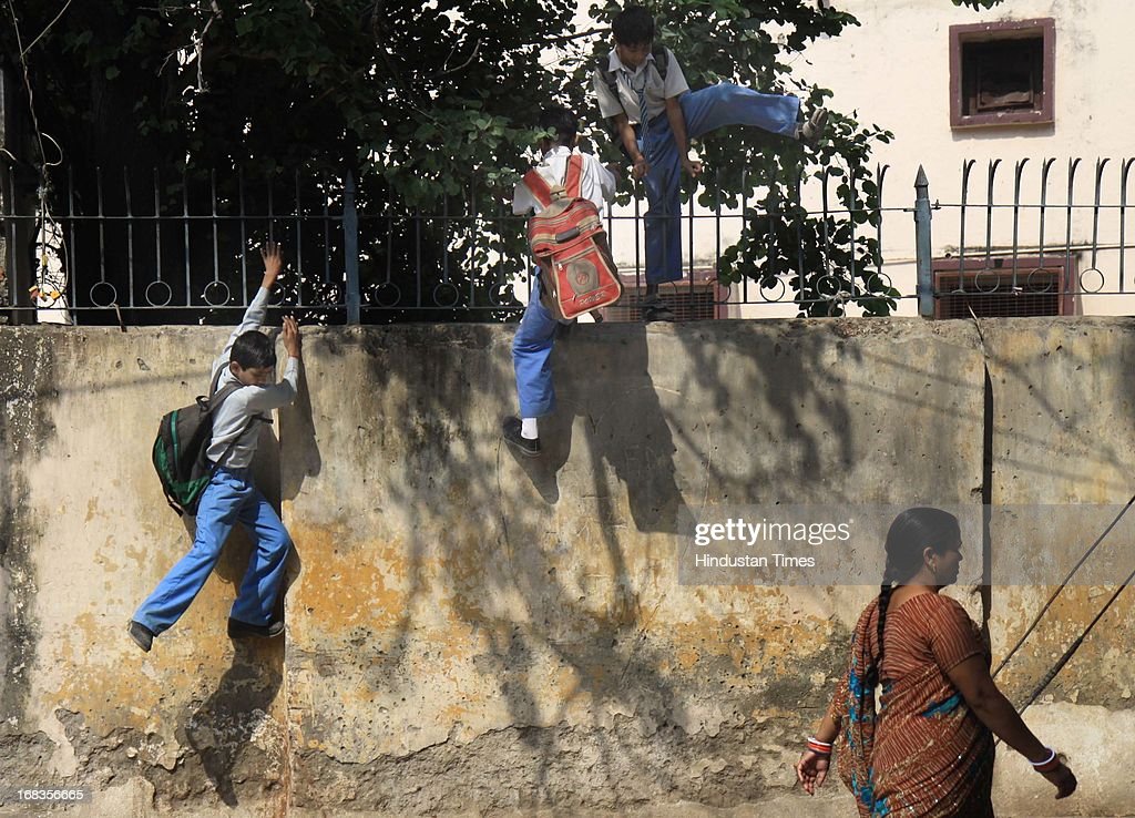 Students jumps over the school buildings to bunk classes at govt news photo