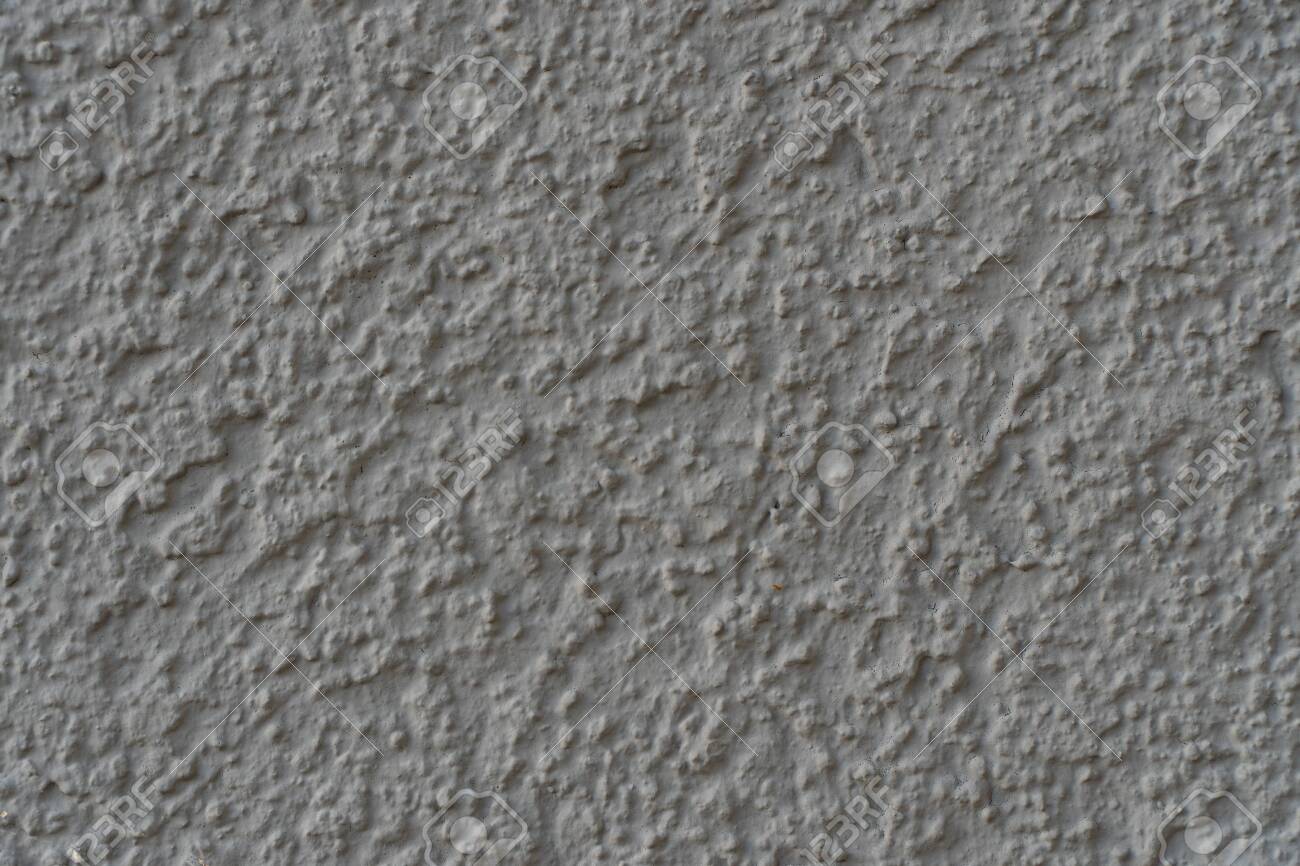 Background image of a wall covered with textured paint wallpaper substrate for text detailed texture of decorative stucco wall in the interior and exterior top view stock photo picture and royalty free