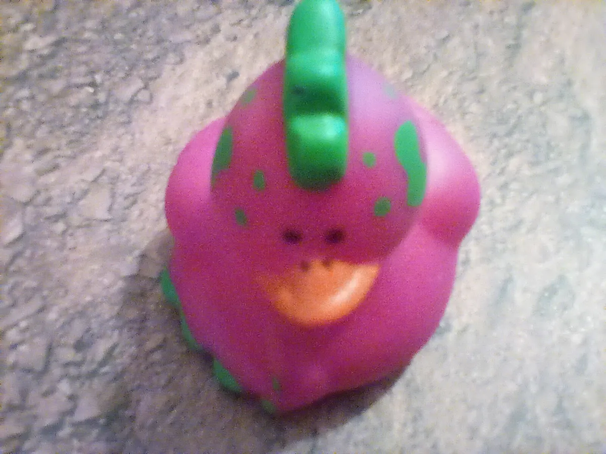 Purple dinosaur rubber duck