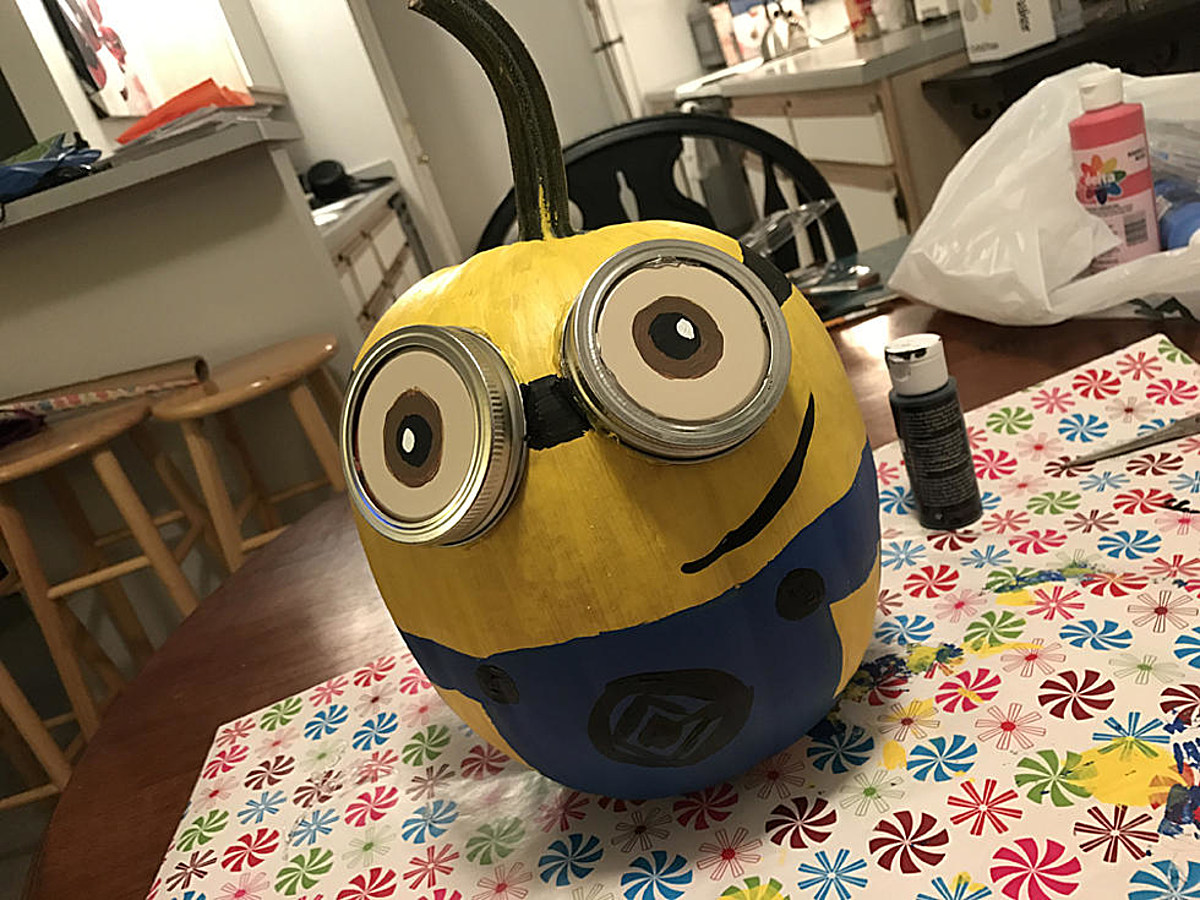 Following cdc guidelines paint this fun minion pumpkin at home