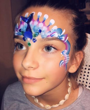 Mermaid face painting party with mermaid bling glitter gloss hair color