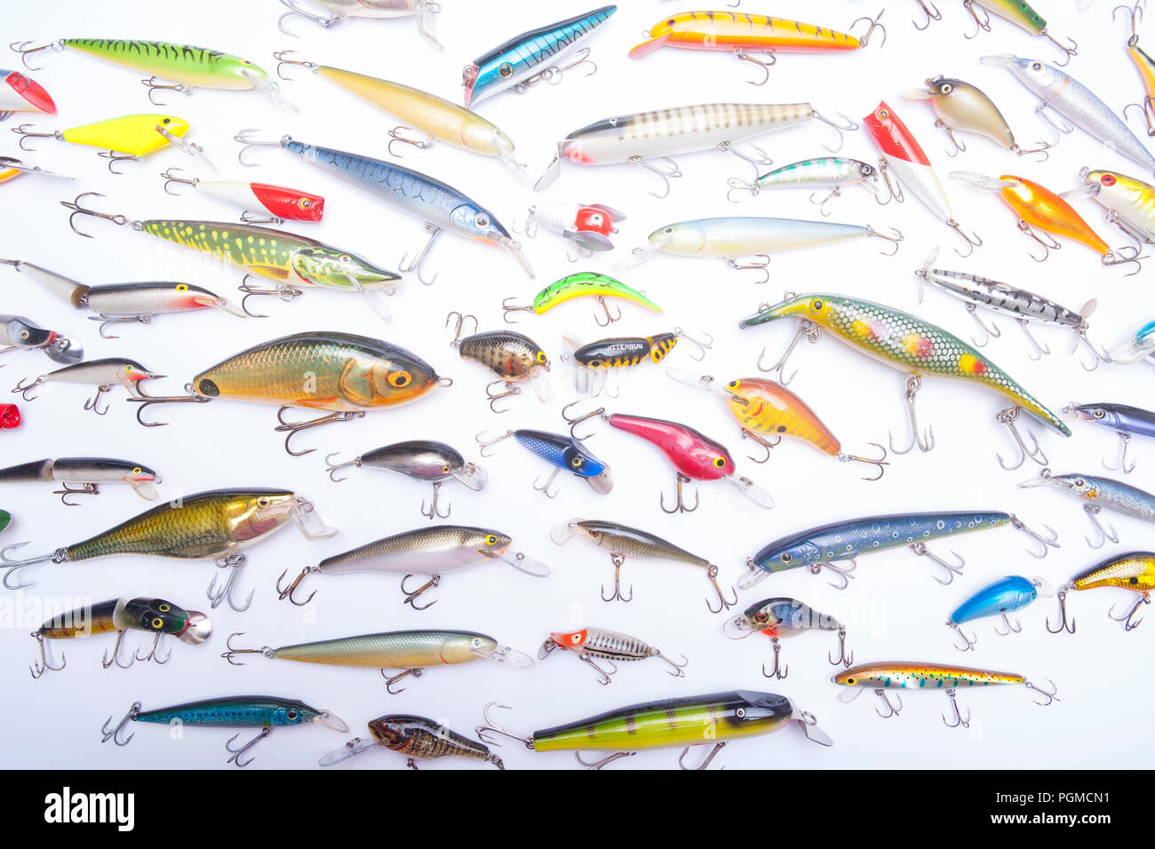 Different lures for fishing in the sand. Wobblers for catching predatory  fish. Hard lures in the sand Stock Photo - Alamy