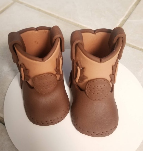 Handmade fondant baby cowboy boots cake topper