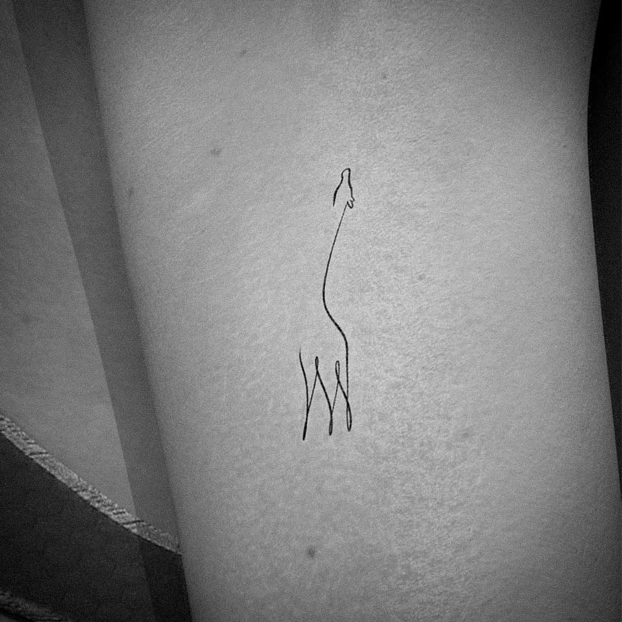 Tiny and cute giraffe tattoo design inku paw