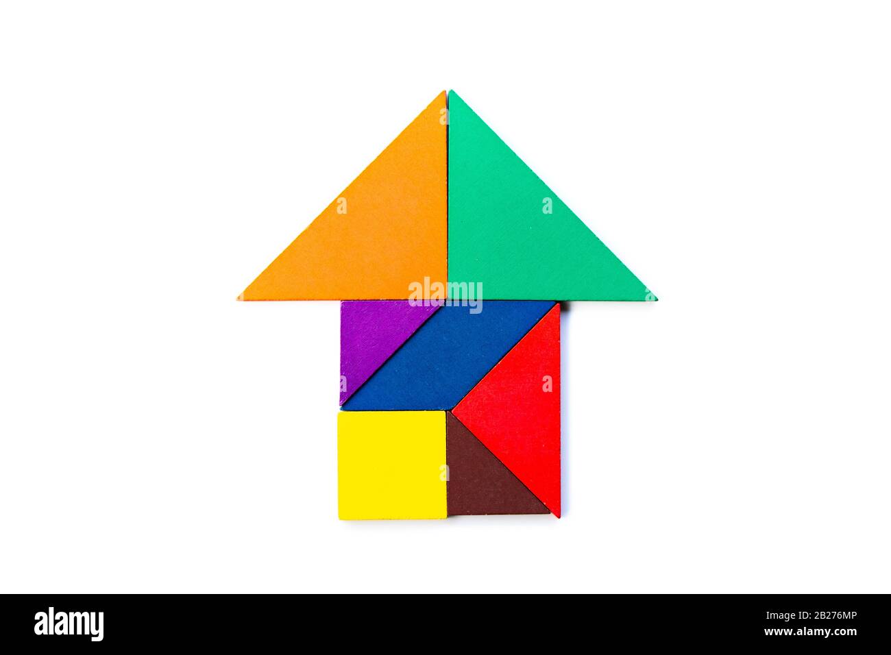 Color wood tangram puzzle in arrow or home shape on white background stock photo