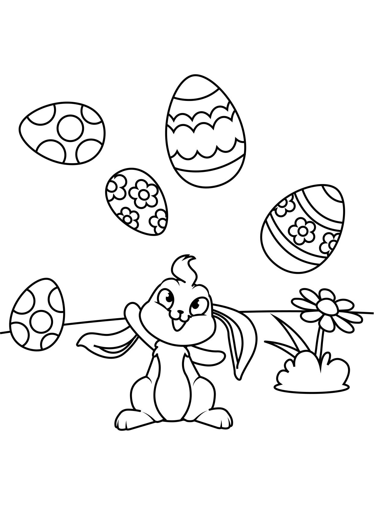 Dibujo para colorear conejito de pascua juega con huevos de pascua