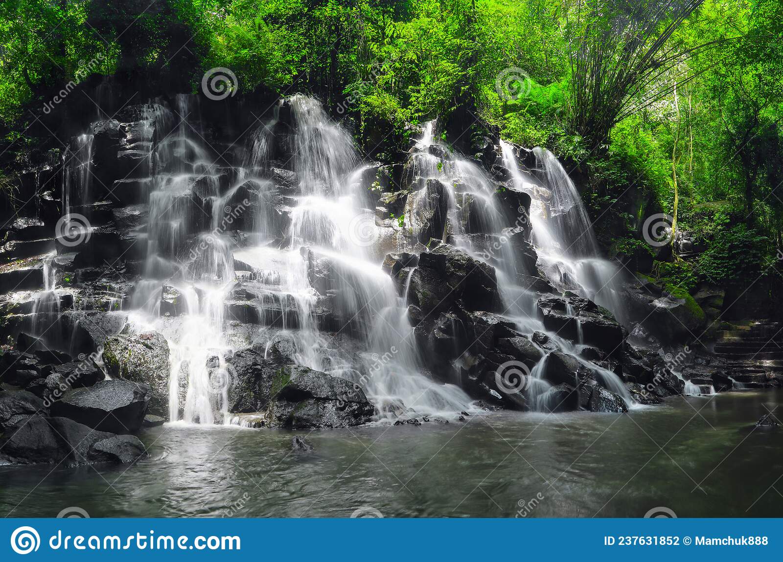 Kanto lampo waterfall in jungle ubud bali island indonesia tropical landscape wallpaper background stock photo