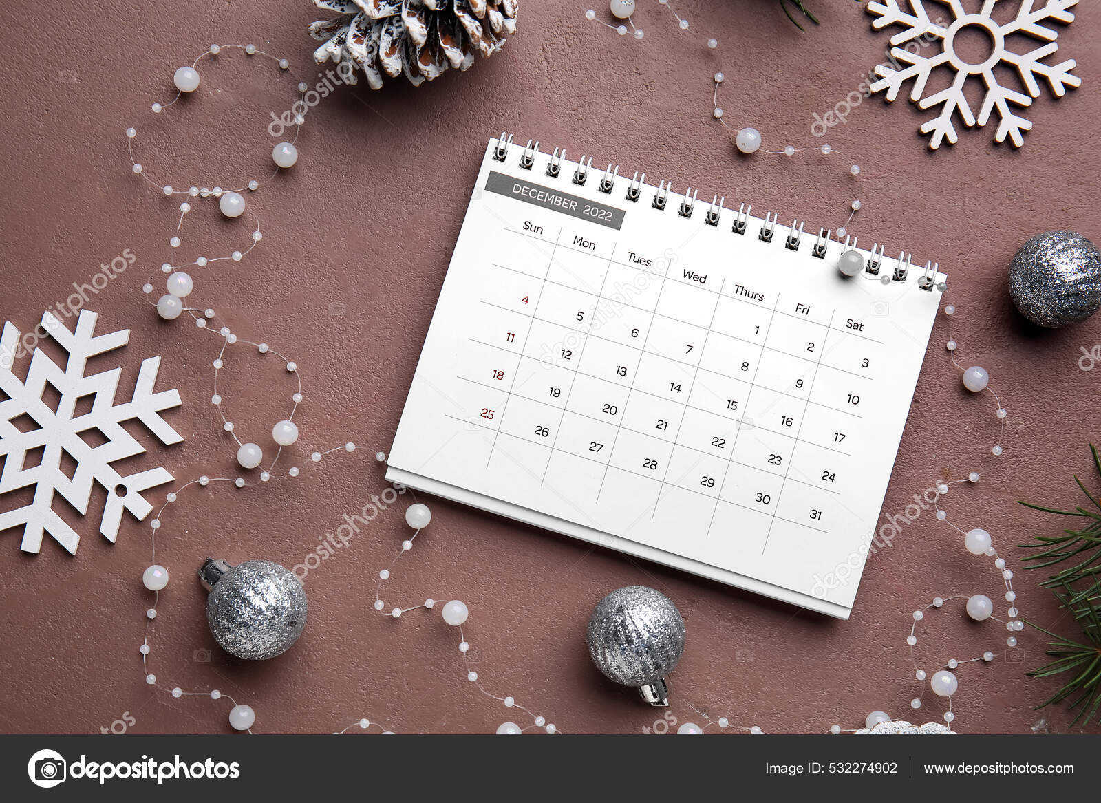 Paper calendar december christmas decor beads color background stock photo by serezniy