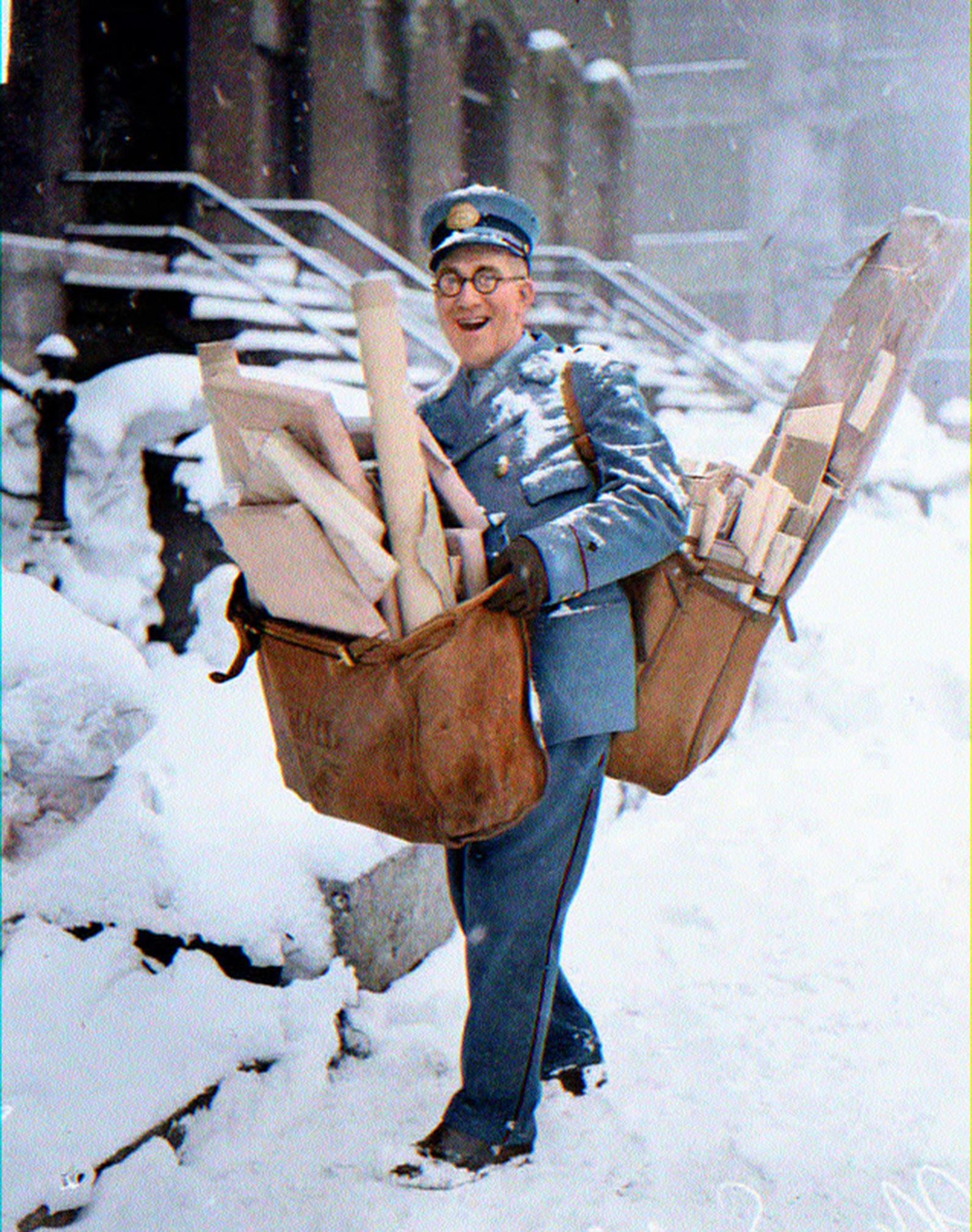 Mailman n sorenson poses with his heavy load of christmas mail and parcels chicago rcolorizedhistory