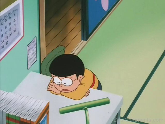 Image of nobita sleeping on study table