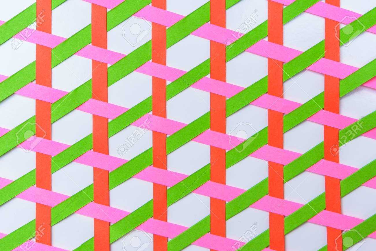 Color paper red green and pink were weave with vertical pattern stock photo picture and royalty free image image