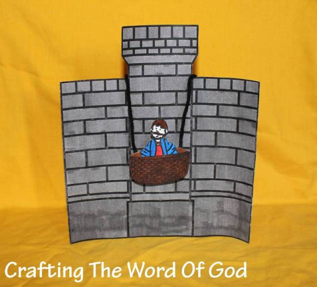 Paul lowered in a basket crafting the word of god