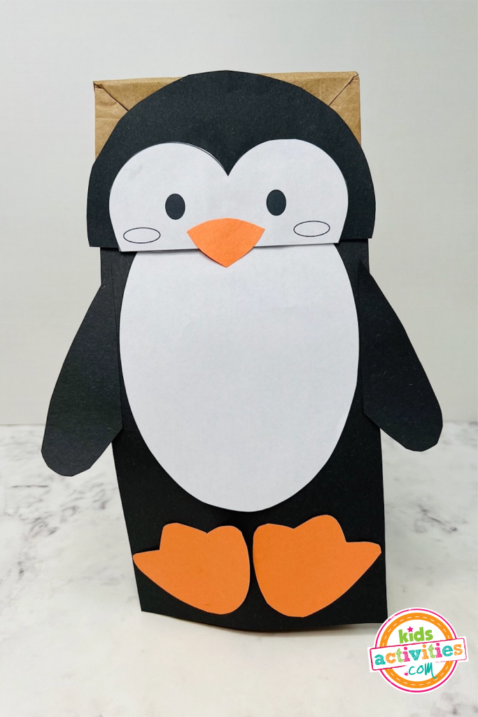 Free penguin craft template to make a paper bag penguin puppet kids activities blog