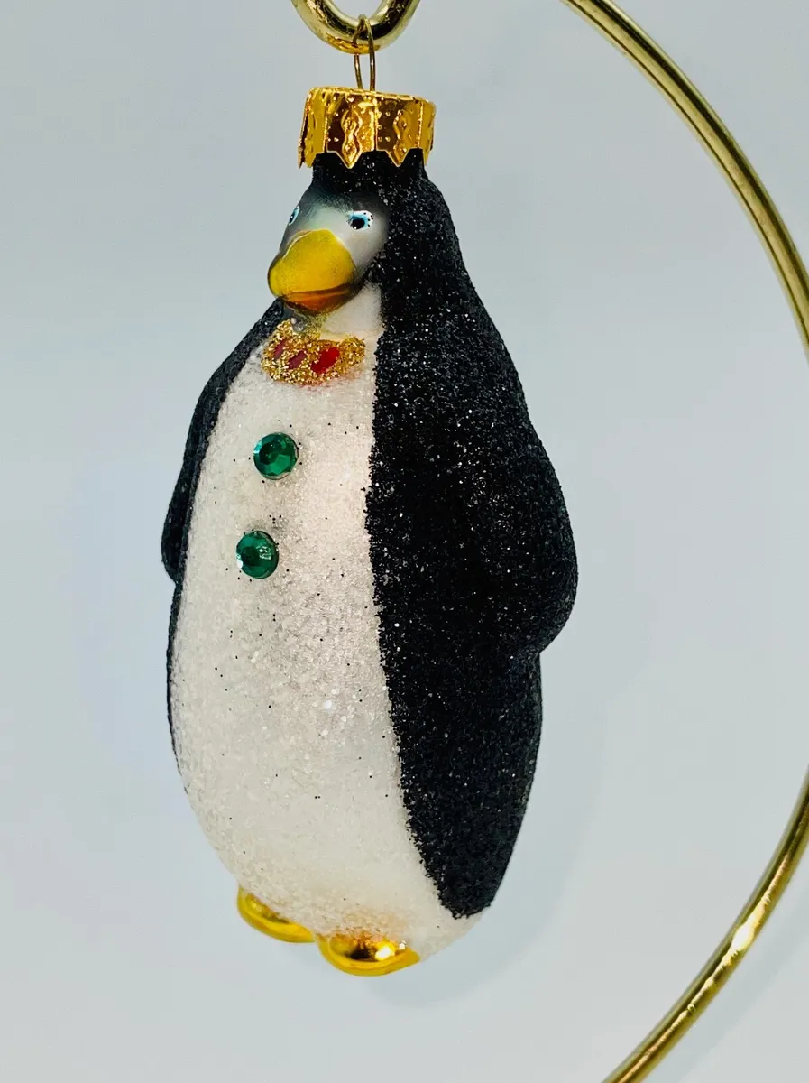 Delightful sparkly little penguin ornament wearing a bow tie