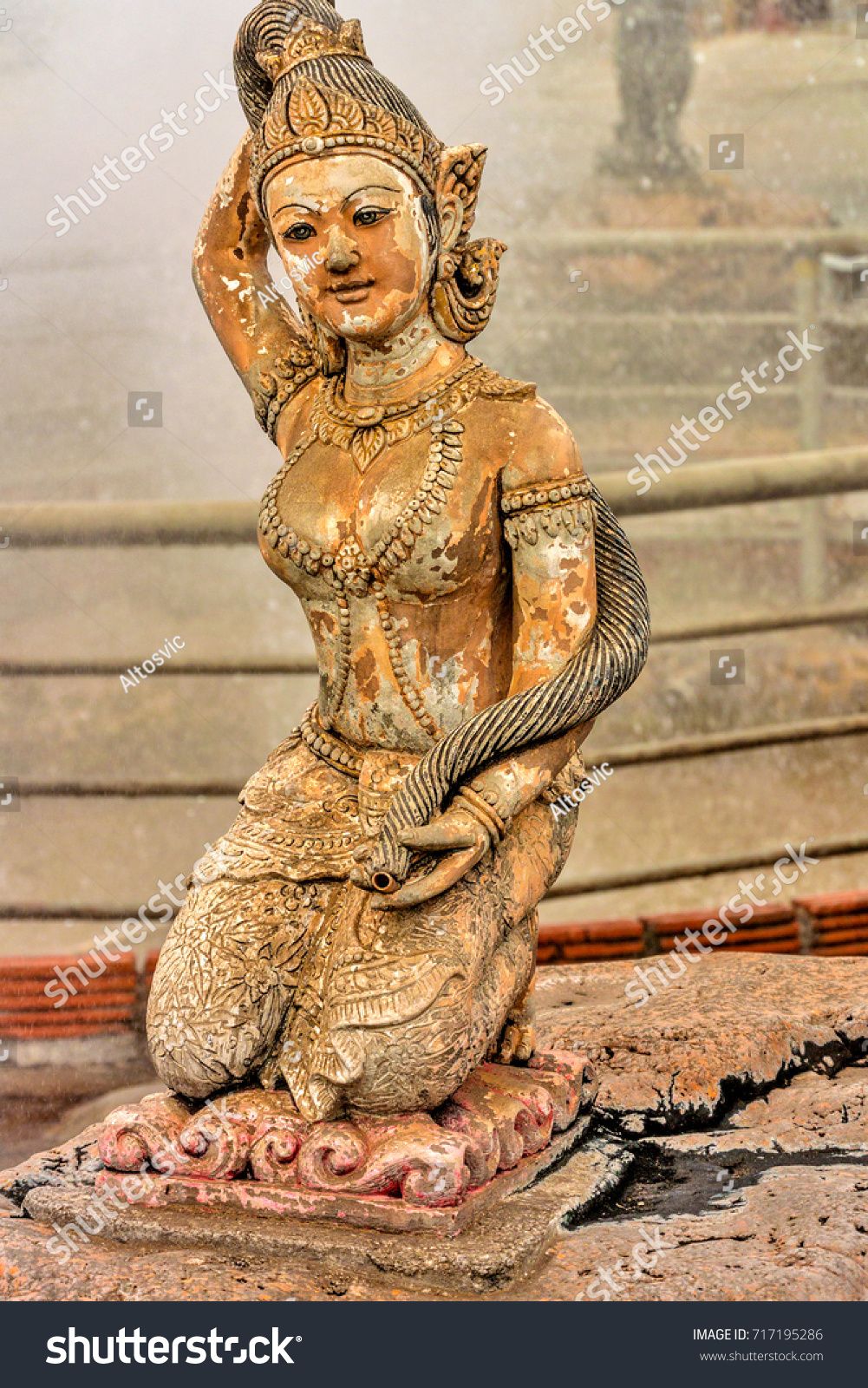 Phra mae thorani goddess earth wringing stock photo