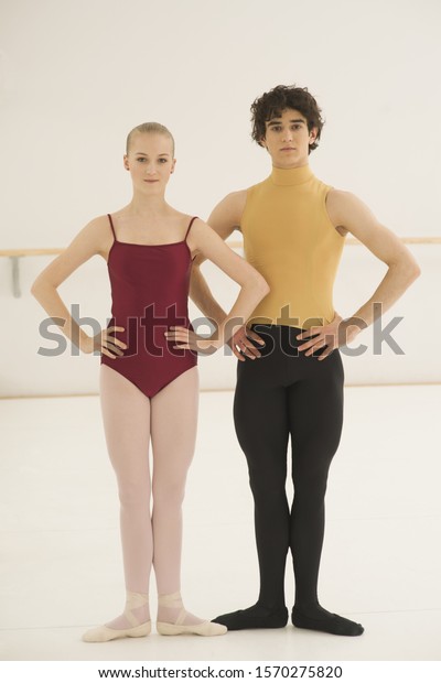 Male female ballet dancers standing together stock photo