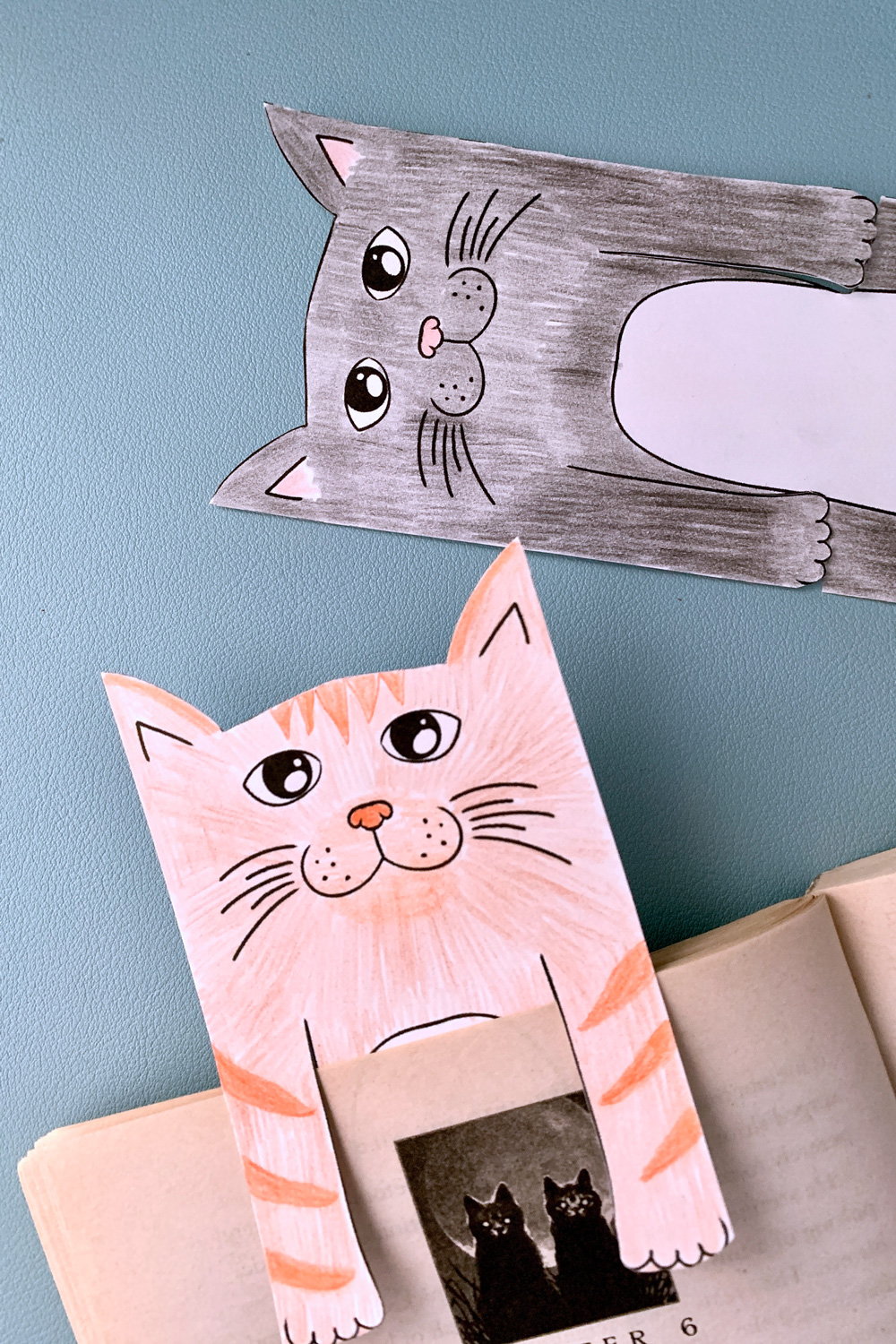 Color a cute printable cat bookmark to save your page