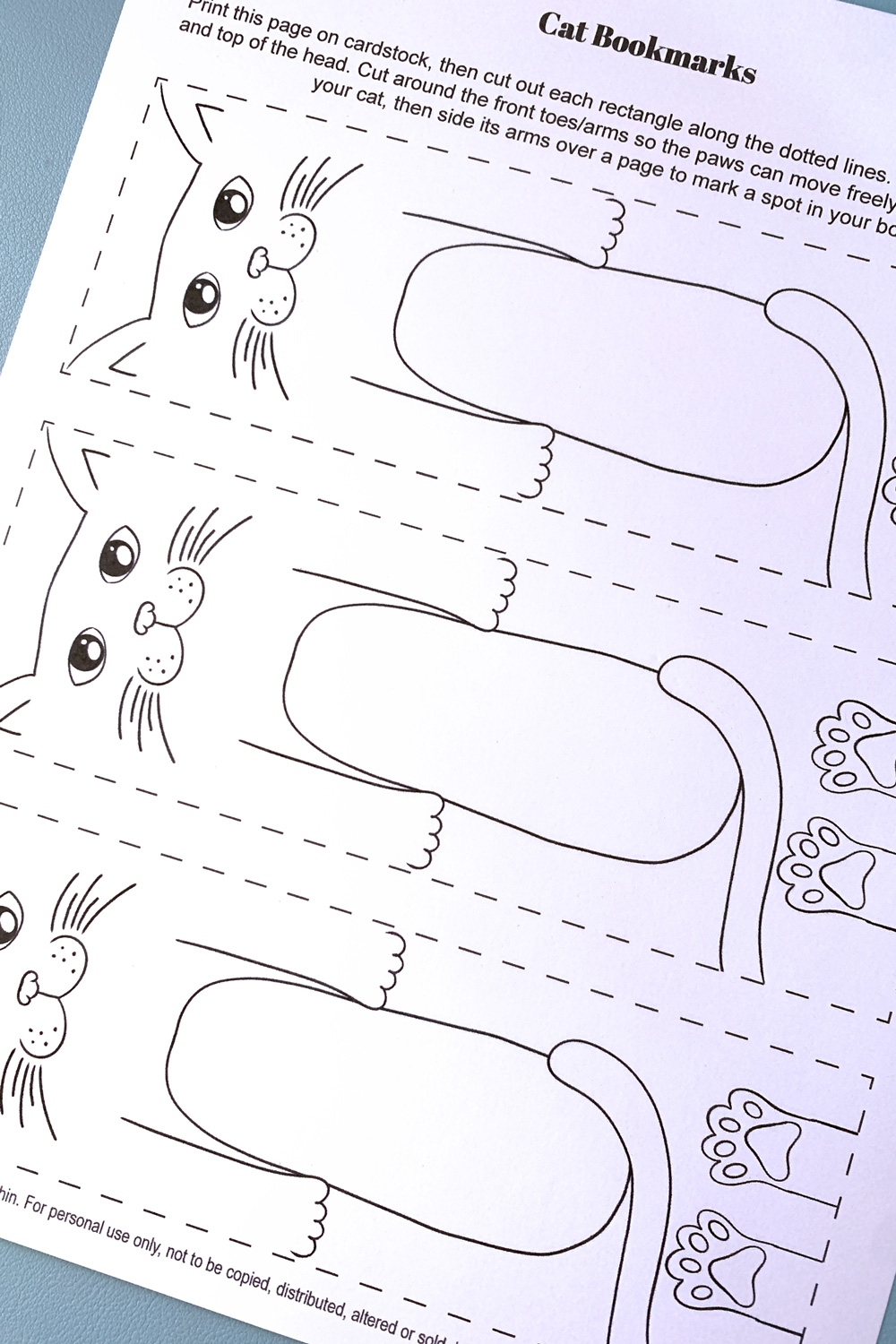 Color a cute printable cat bookmark to save your page