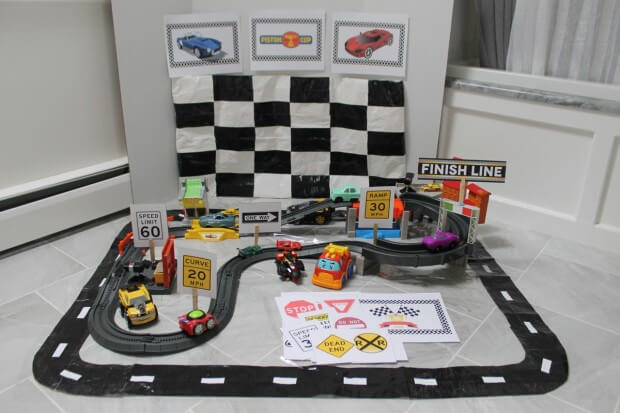 Race car printables with diy checkered flag and race track play mat