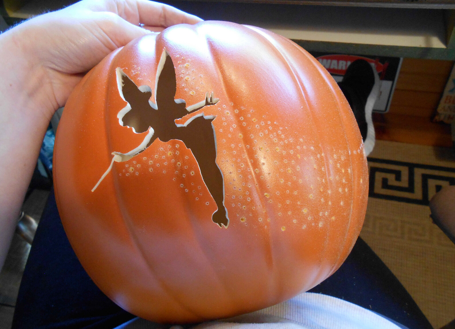 Pixie pumpkin carving a tinkerbell jack