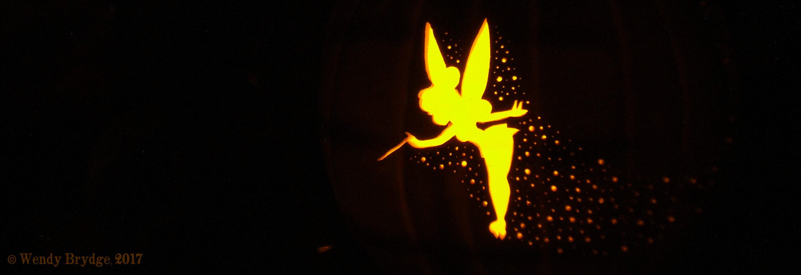 Pixie pumpkin carving a tinkerbell jack