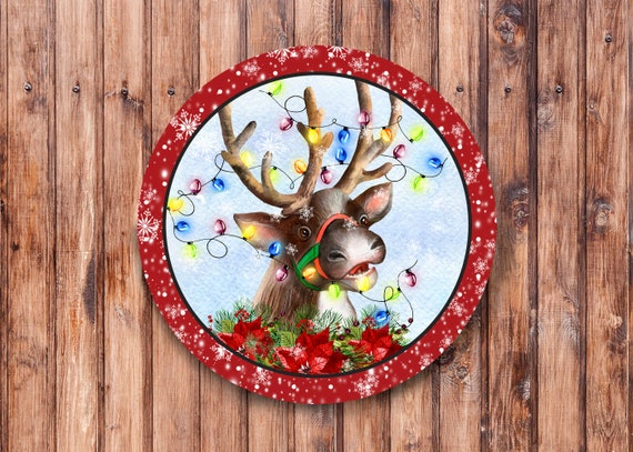 Reindeer tangled in christmas lights wreath sign