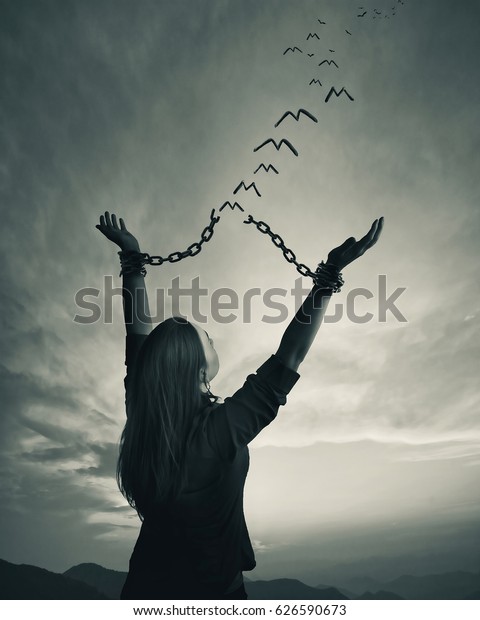 Woman breaks her chains links turn stock photo