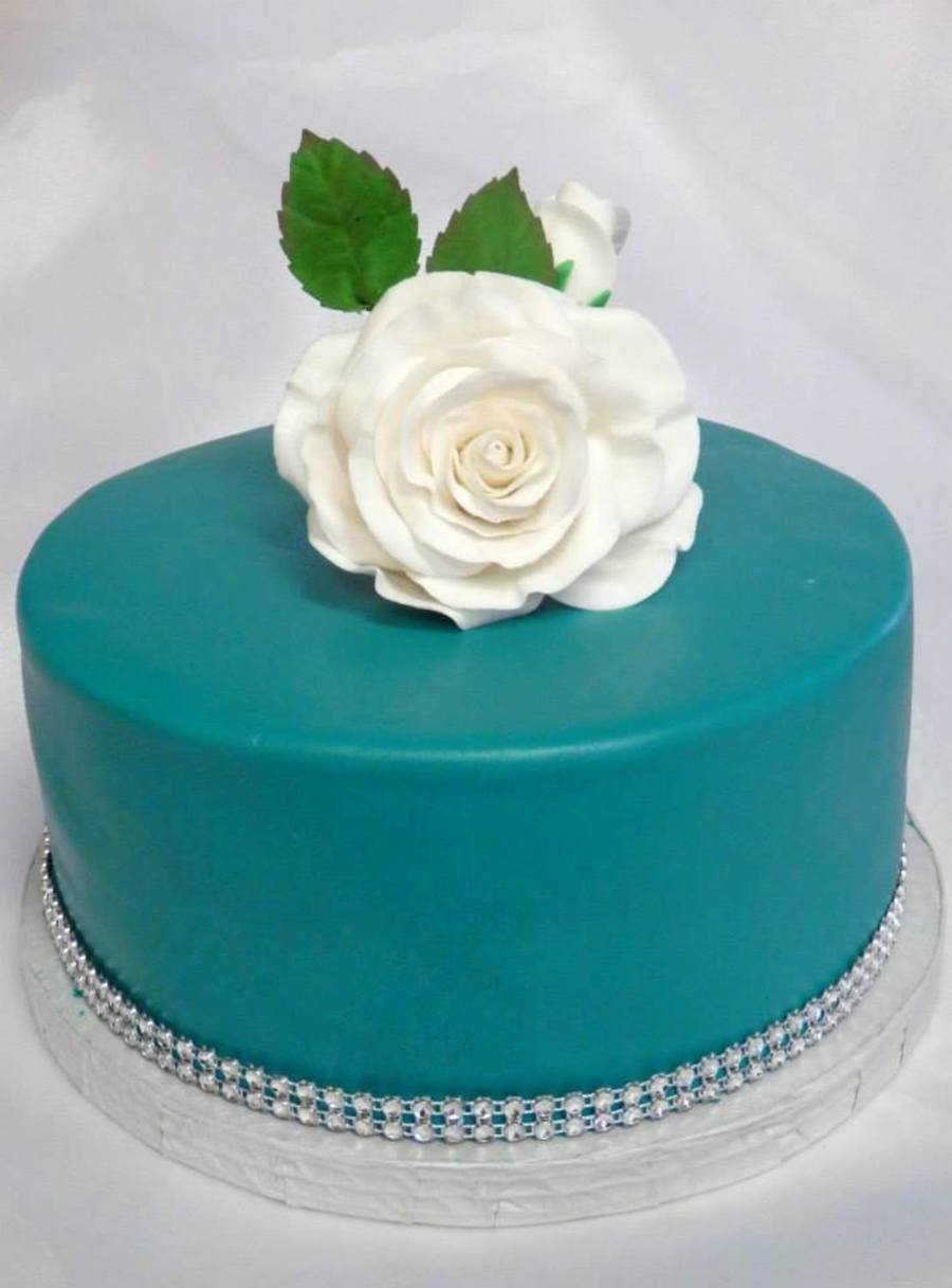 Birthday cake turquoise color with some black to deepen it simple rose birthday lady loved it