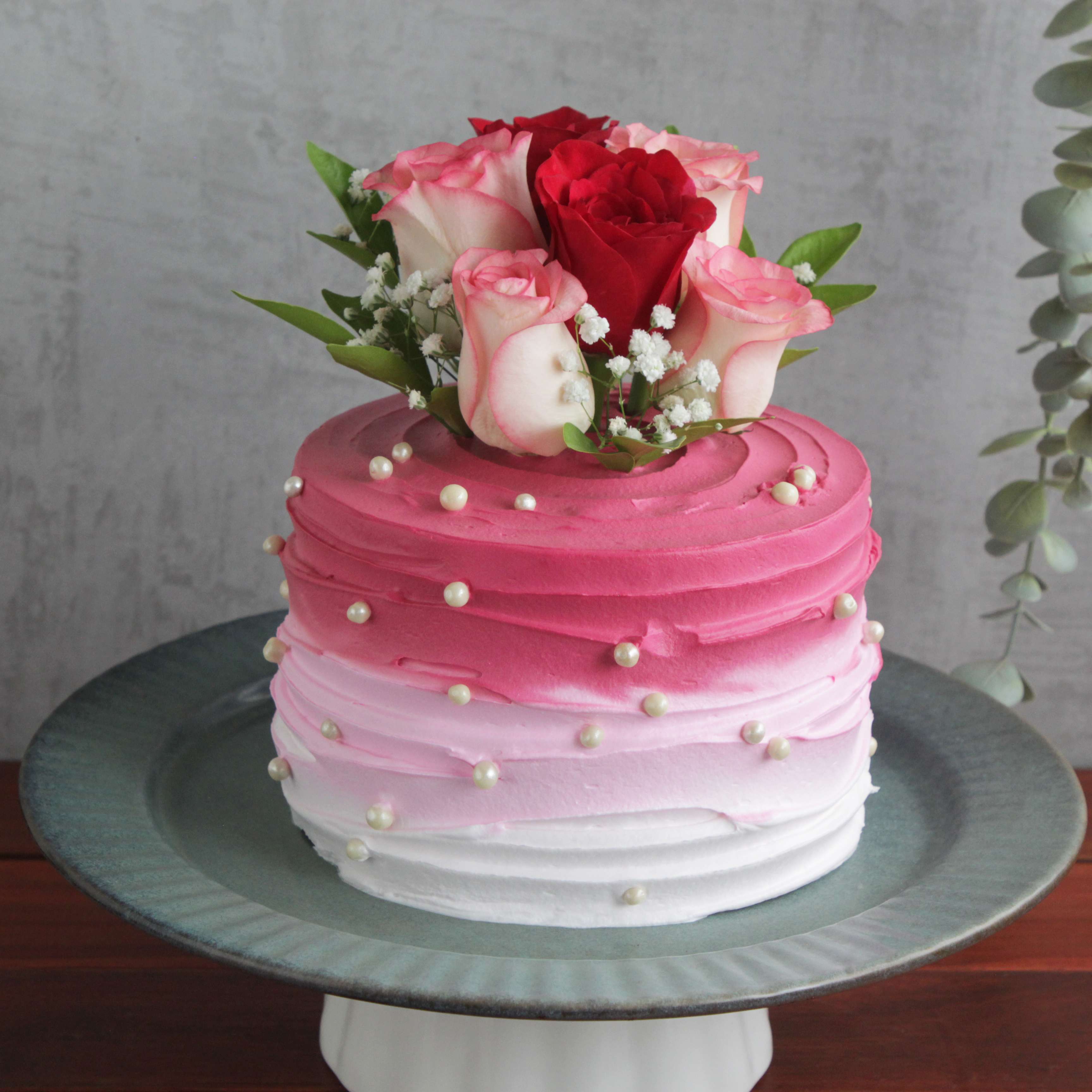 Pk shaded cake with assorted fresh roses eggless