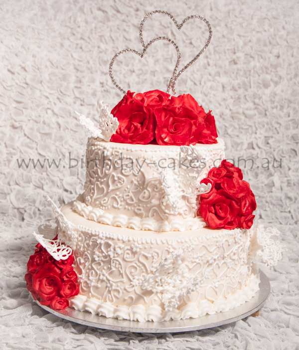 Butterflies and roses wedding cake