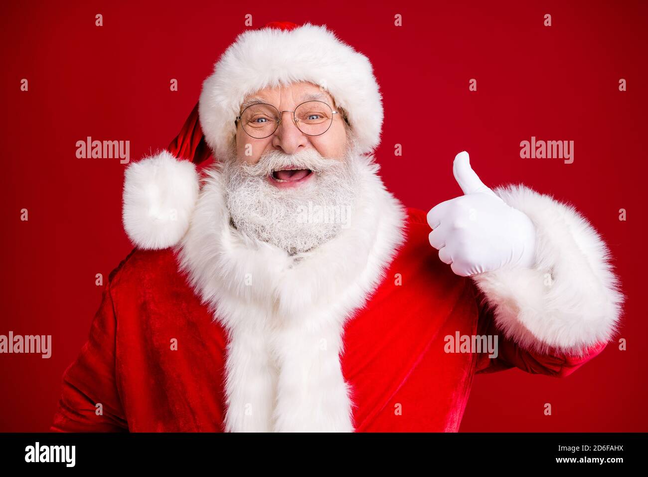 Portrait of crazy funky santa claus show okay sign x