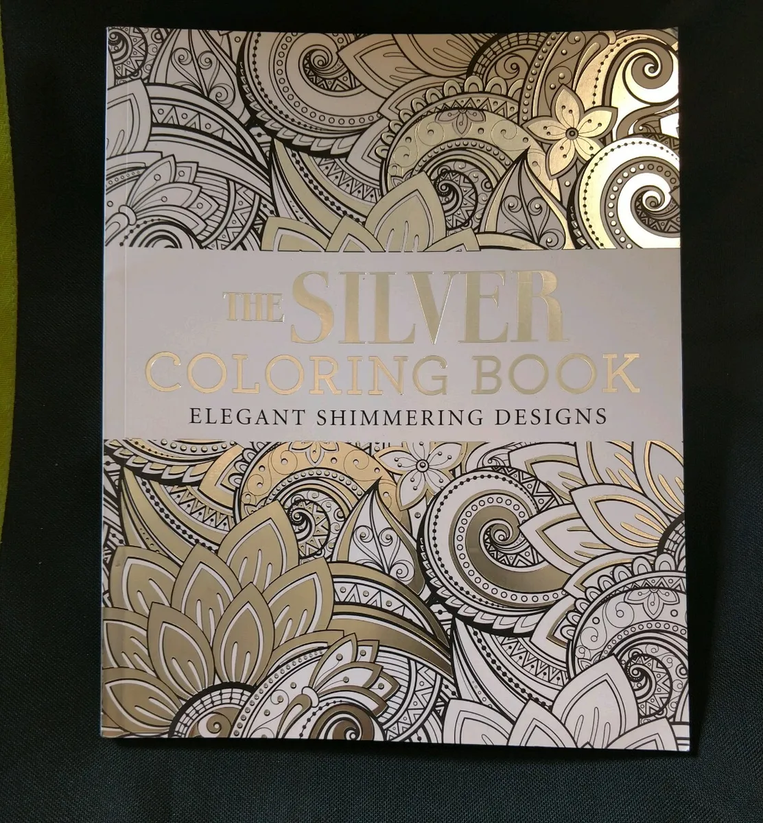 The silver coloring bookelegant shimmering designsbarely opened nice