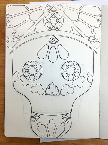 Using stencils to draw sugar skulls