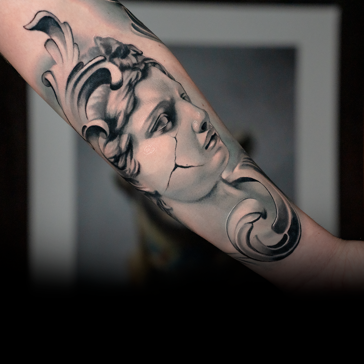 From marble to skin realistic statue tattoo in gray tones â