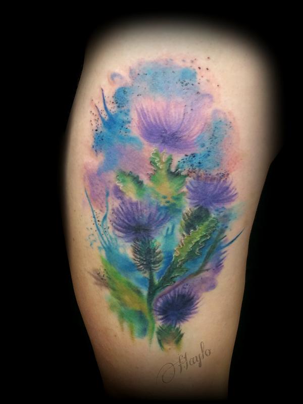 Thistle blossom watercolor style tattoo by haylo