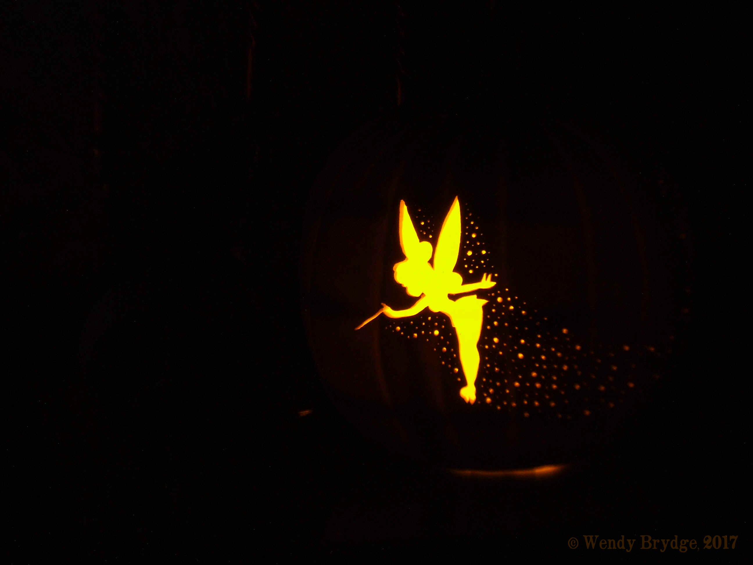 Pixie pumpkin carving a tinkerbell jack