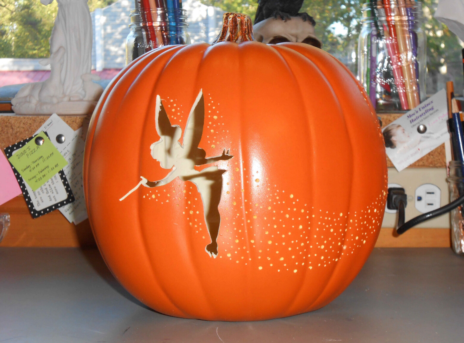 Pixie pumpkin carving a tinkerbell jack