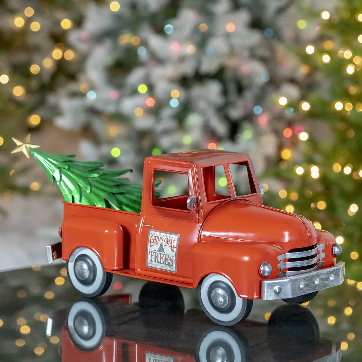 Long old style metal christmas truck with tree