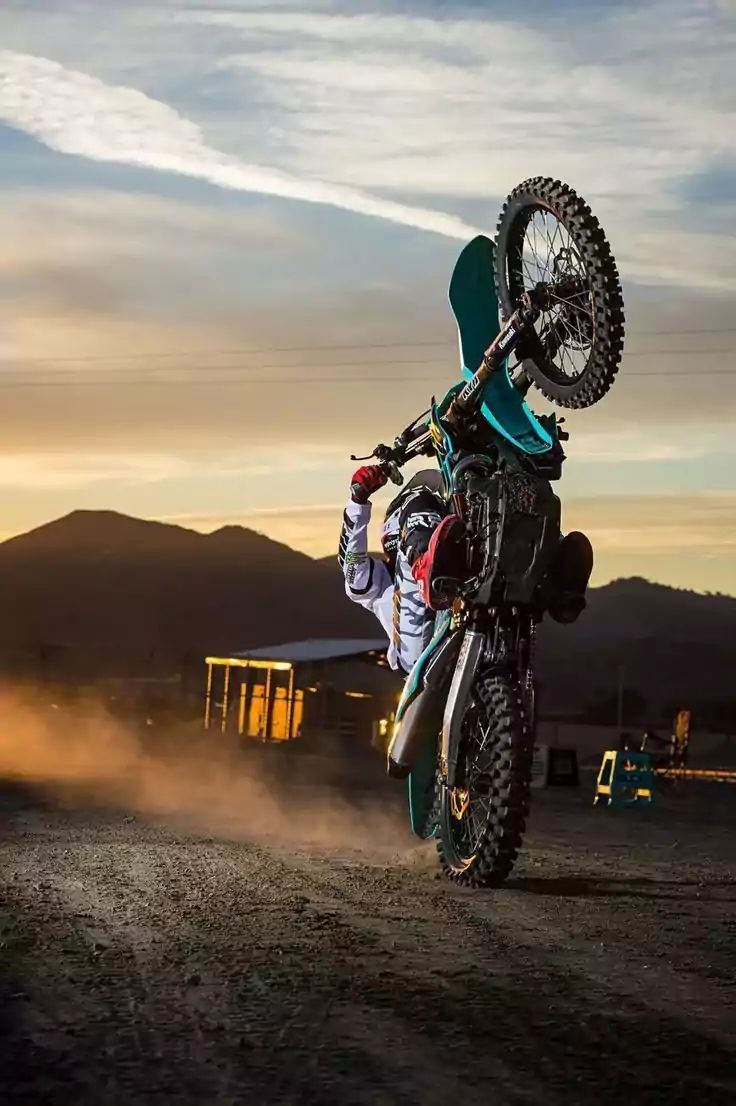 Dirt bike wallpaper explore more dirt bike dirt jumping motorized mountain bike performing wallpaper httpsâ in dirt bike racing racing bikes dirt bike wheelie