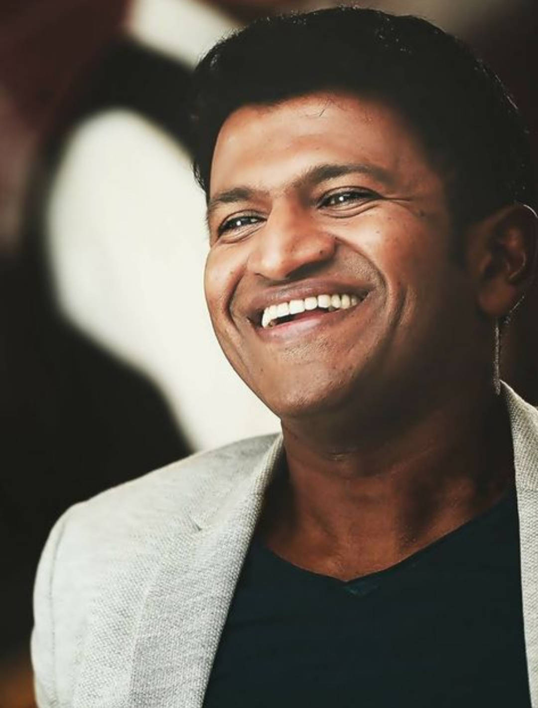 Download puneeth rajkumar happy portrait wallpaper