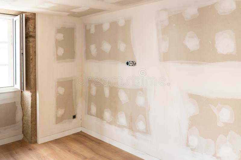 Unfinished drywall panel house walls and ceiling stock image