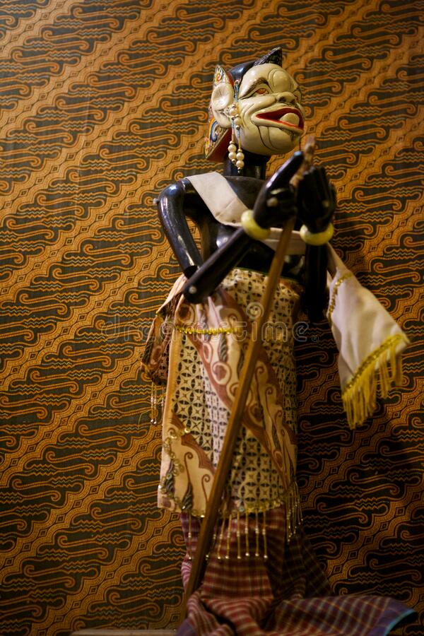 Wayang golek with batik background stock image