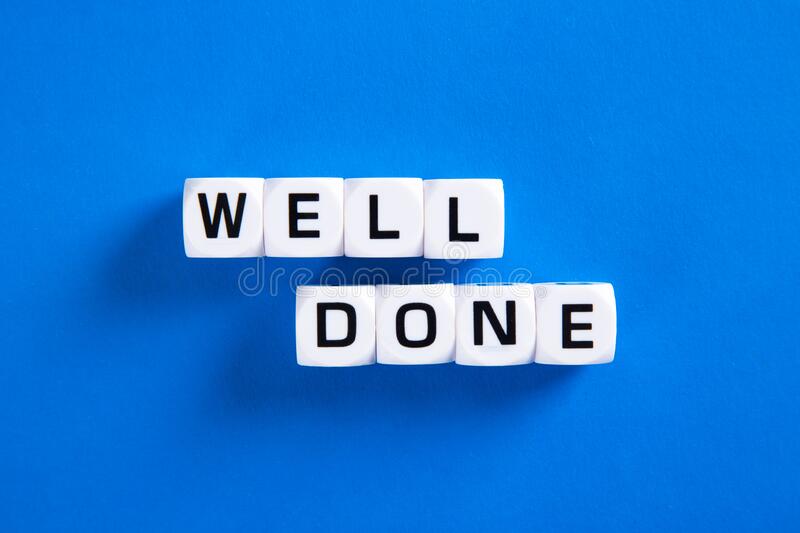 Well done letters on blue background stock photo