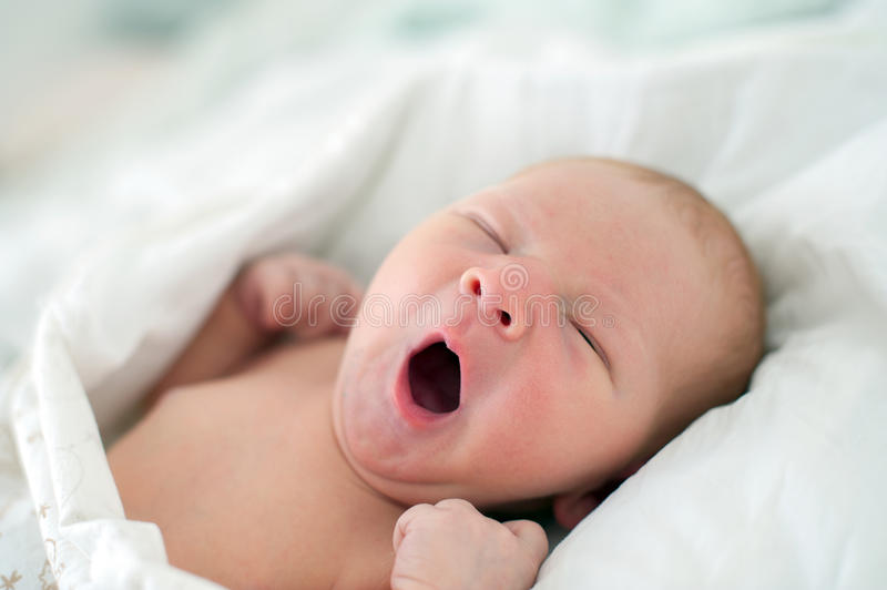 Baby yawning stock photos