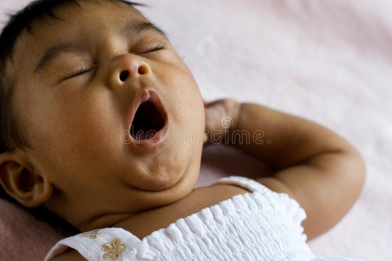 Cute yawning indian baby stock photo image of baby innocense